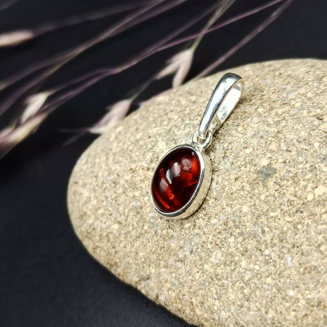 Deep red Baltic amber pendant necklace in silver