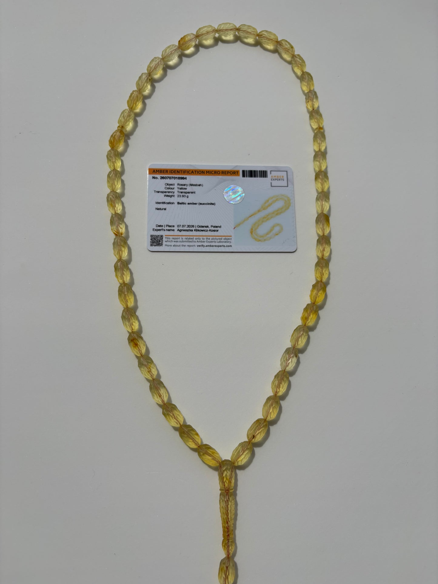 Collector-grade carved lemon amber rosary with certificate.