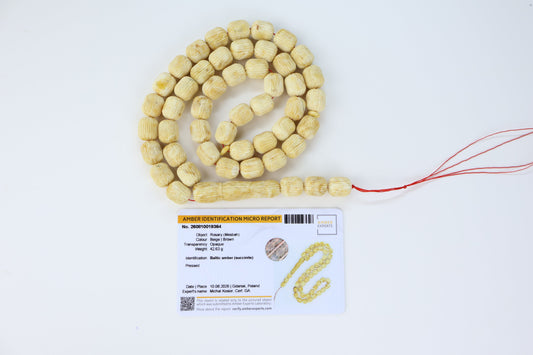Certified hand-carved opaque beige and brown Baltic amber misbaha rosary with 48 beads measuring 12x10 mm by Tetibel.