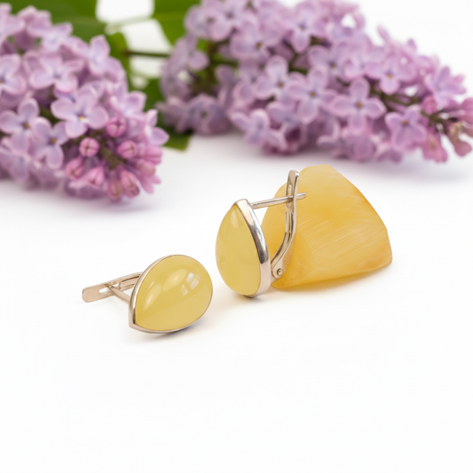 Close-up detail of Milky Yellow Amber Teardrop Earrings, showing the sterling silver setting and natural amber stone.