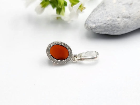 Cognac Baltic amber oval pendant in silver