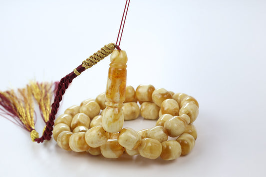 Luxury butterscotch Baltic amber tasbih with smooth round beads and traditional maroon tassel