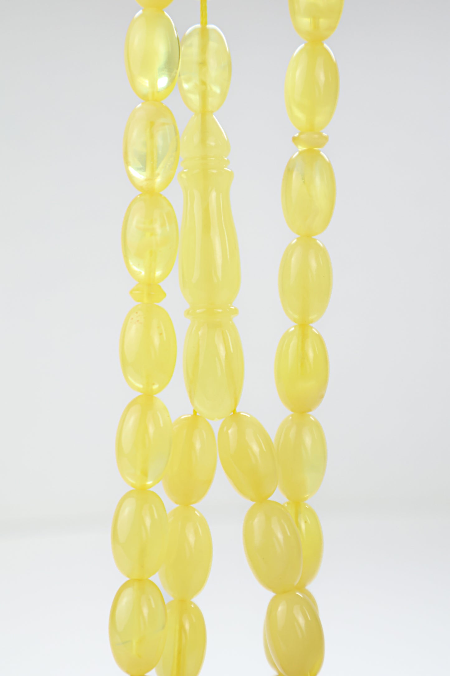 Certified natural translucent yellow Baltic amber misbaha rosary with 42 beads measuring 14.5x9 mm by Tetibel.