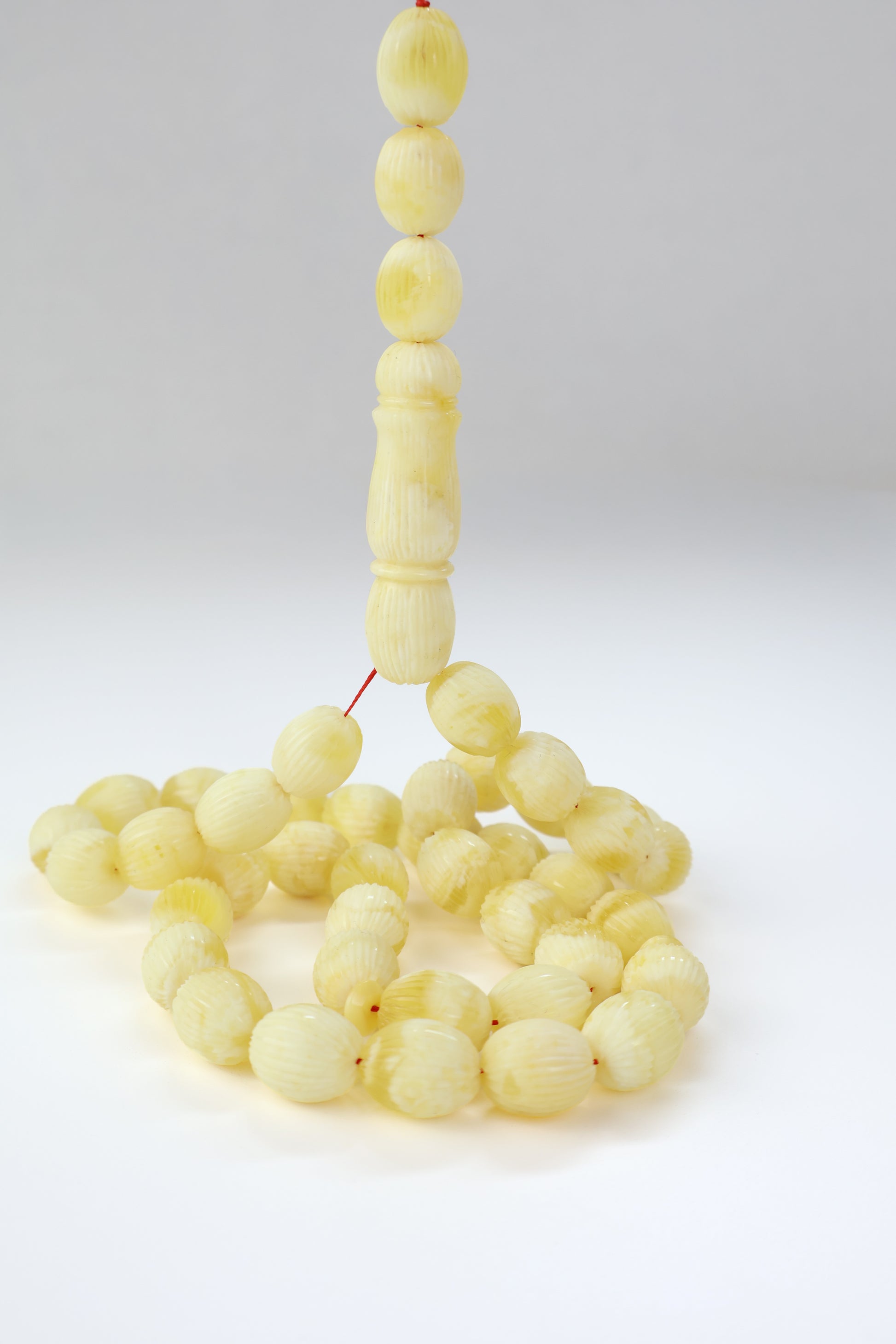 Pressed Baltic amber carved textured prayer beads 42 beads 15x12mm 56.12g with lab certificate from Tetibel Amber Jewels