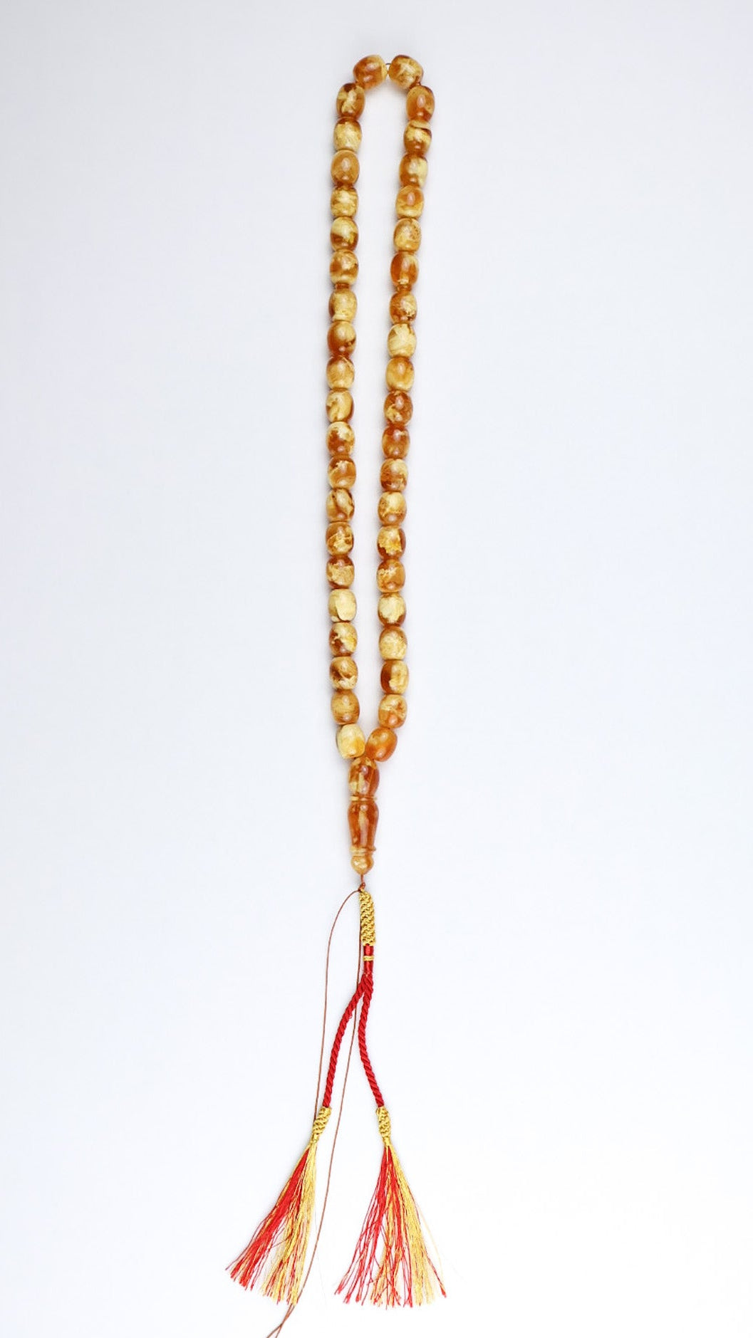 Certified Baltic amber misbaha made of natural succinite with red and gold tassel