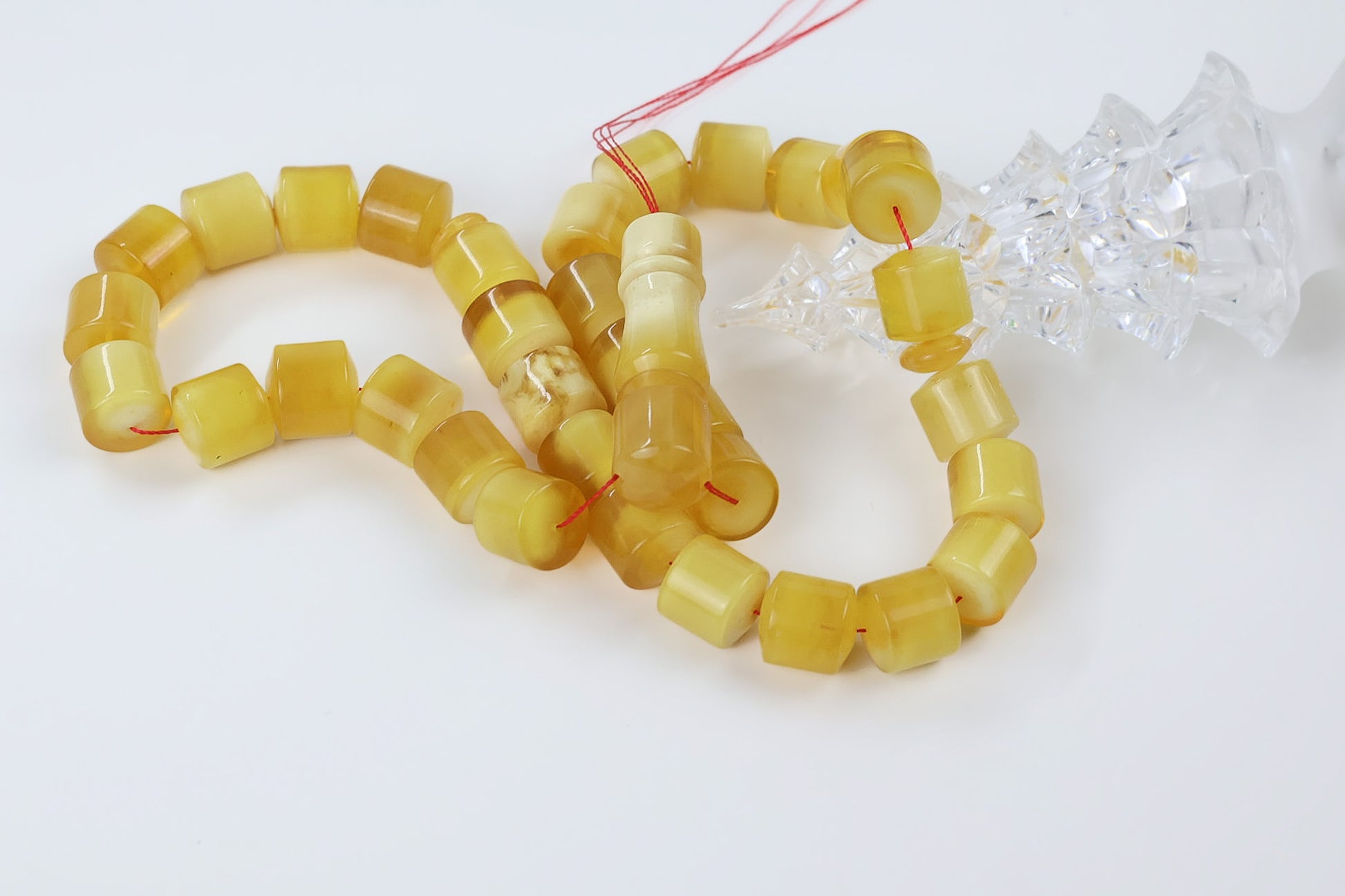 Pressed Baltic amber rosary in butterscotch yellow with polished barrel beads and red thread, handmade 
prayer beads