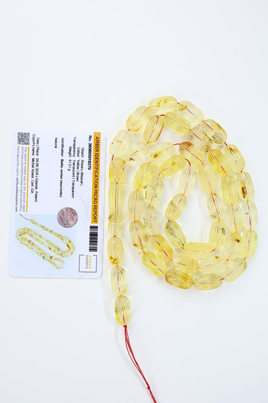 Certified natural hand-carved translucent yellow and brown Baltic amber misbaha rosary with 42 beads measuring 17x9 mm by Tetibel.