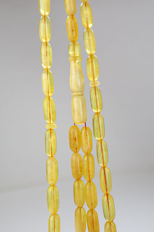 Certified translucent yellow Baltic amber misbaha rosary with 48 beads measuring 13.5x6 mm by Tetibel.