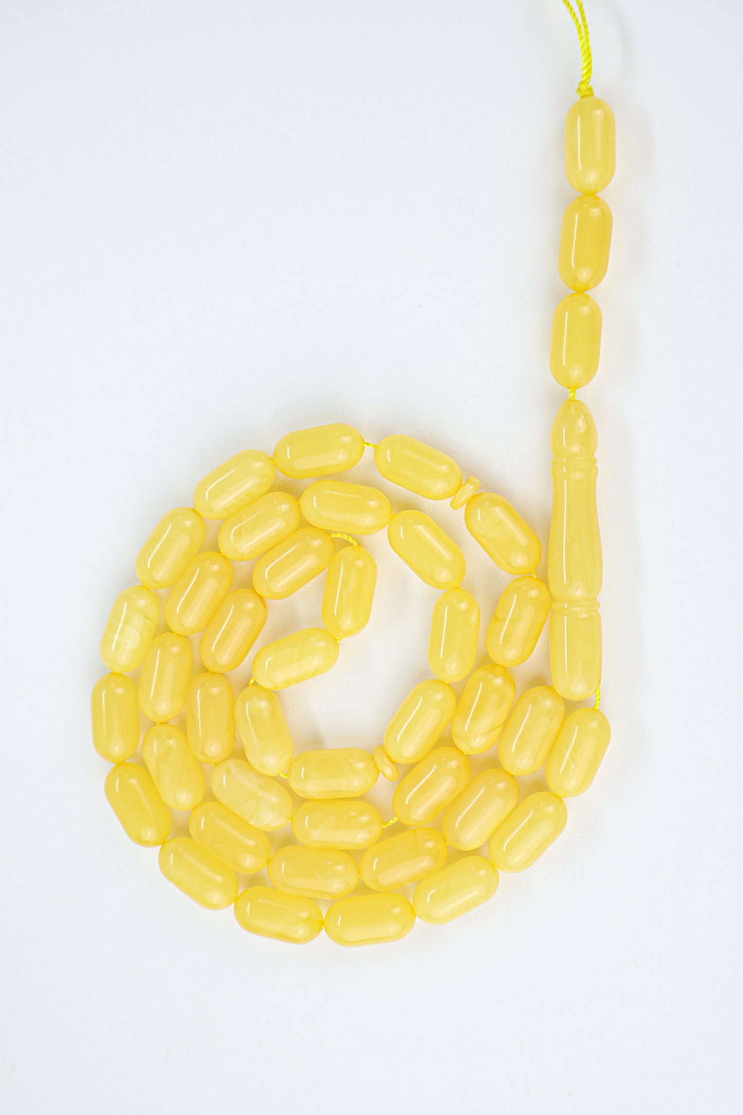 Authentic opaque yellow Baltic amber misbaha strand with traditional amber imam head and 42 beads.