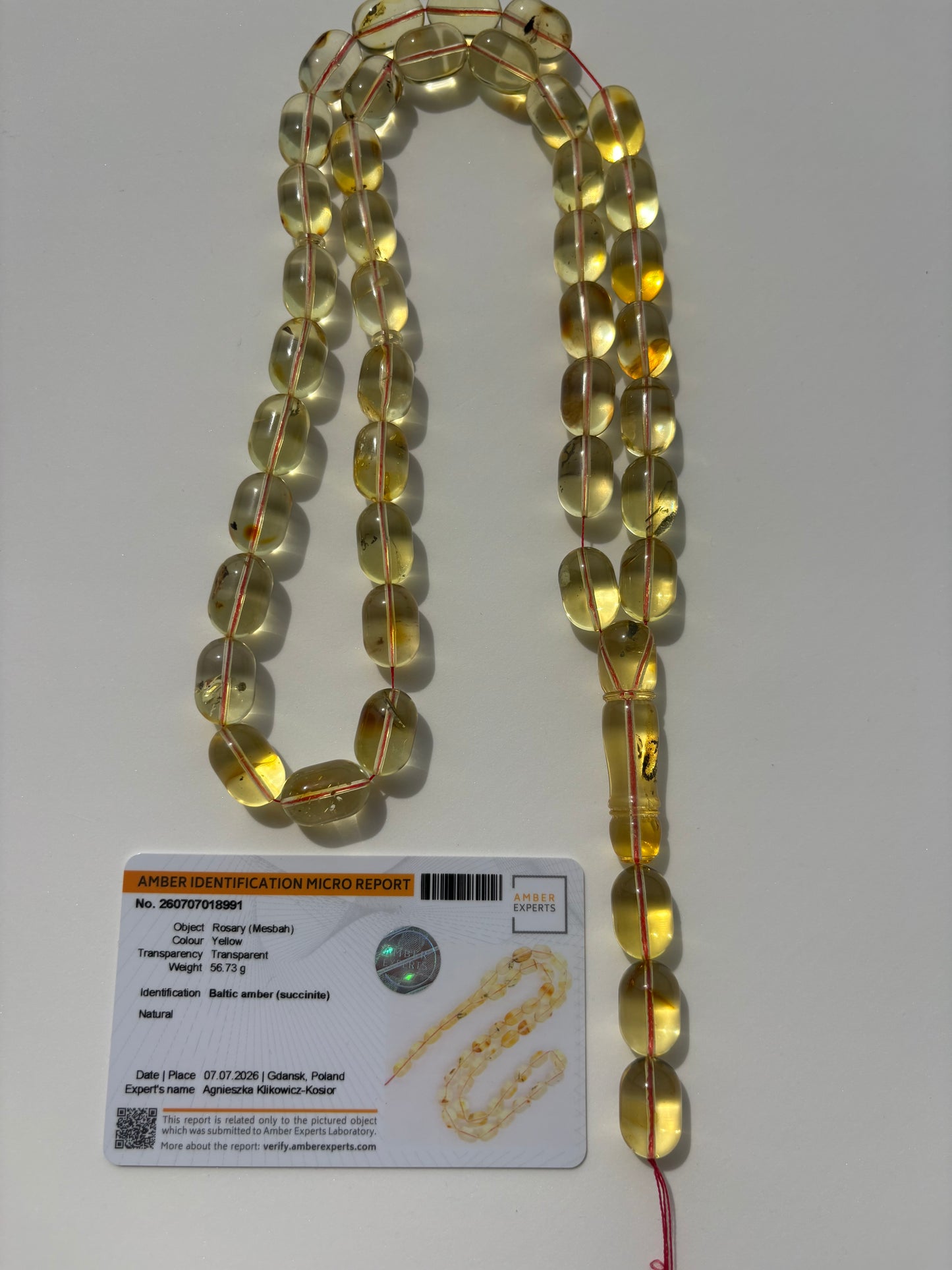 Certified Baltic amber Misbaha featuring large olive-shaped beads.