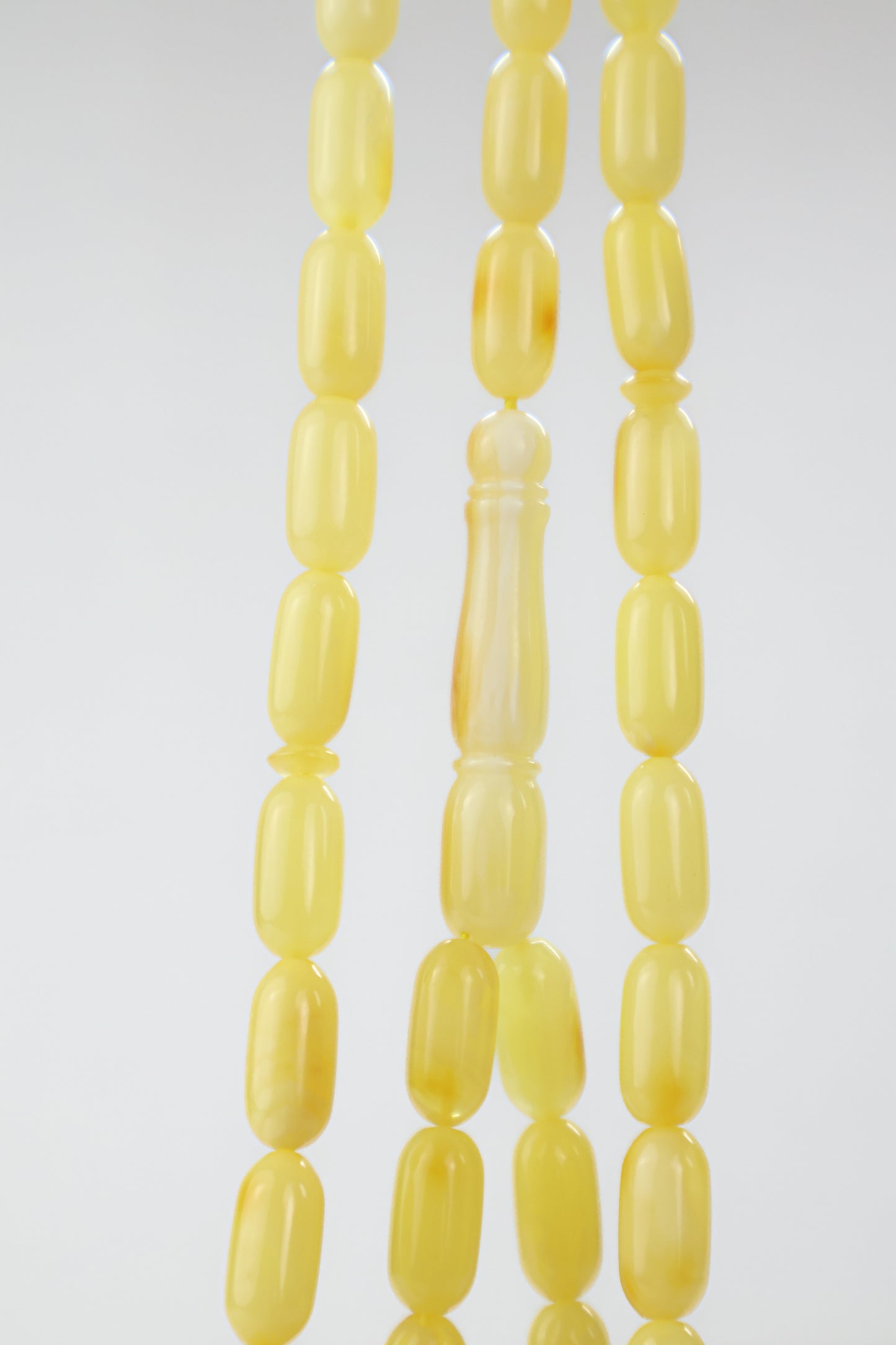 Certified Baltic amber rosary with 42 yellow-orange succinite beads measuring 13.8x6.8mm and weighing 20.3g.