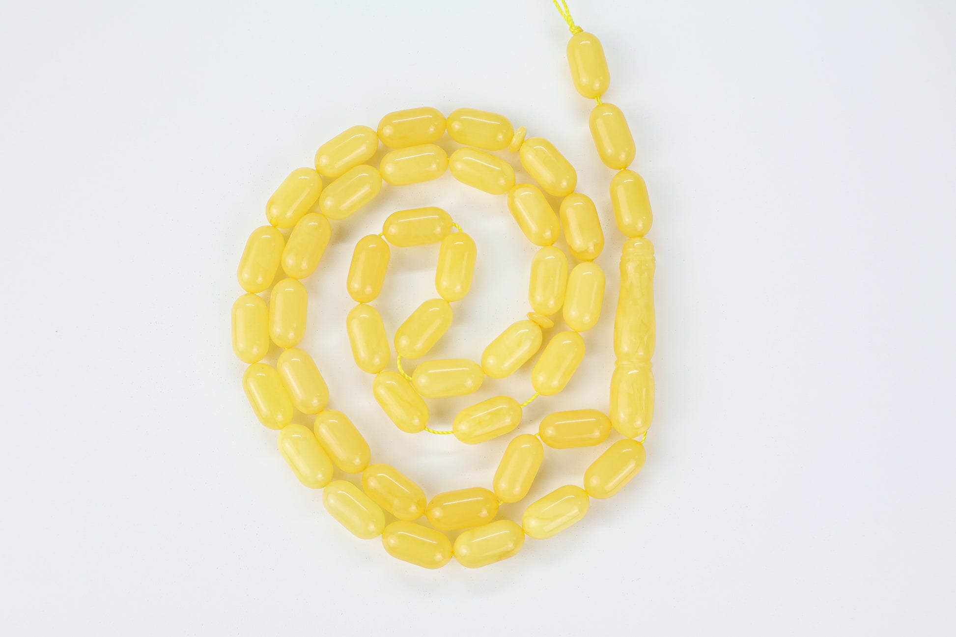 Genuine Baltic amber prayer beads with creamy butterscotch lemon color and laboratory certification.