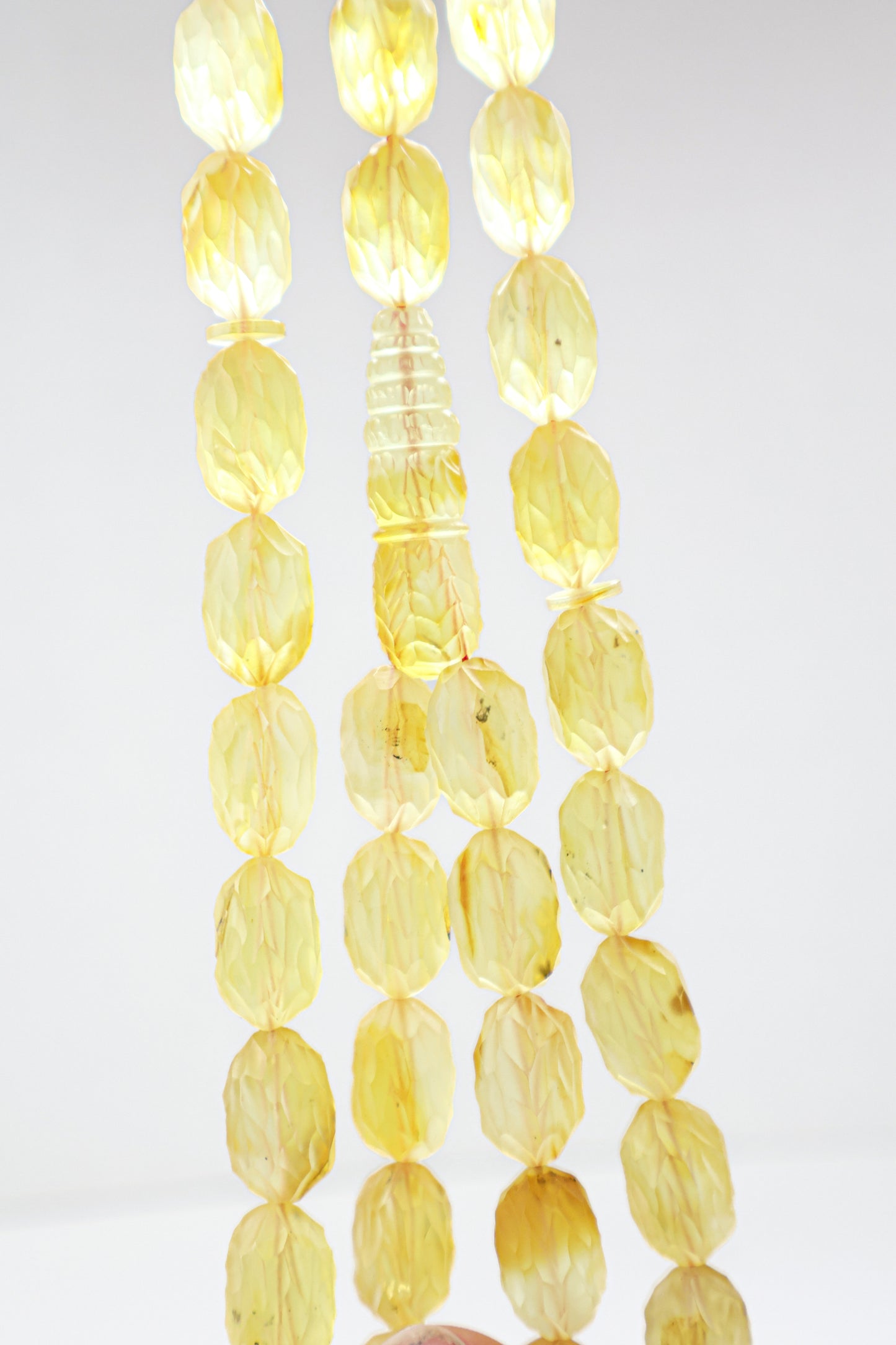 Certified natural hand-faceted translucent yellow Baltic amber misbaha rosary with 42 beads measuring 16.5x10.5 mm by Tetibel.