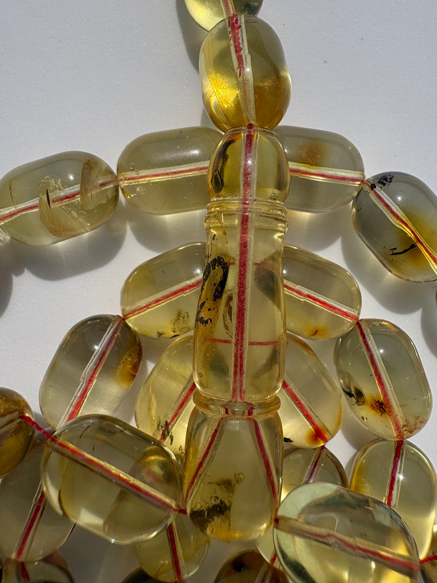Natural Baltic amber Tesbih with 42 transparent oval honey amber beads.