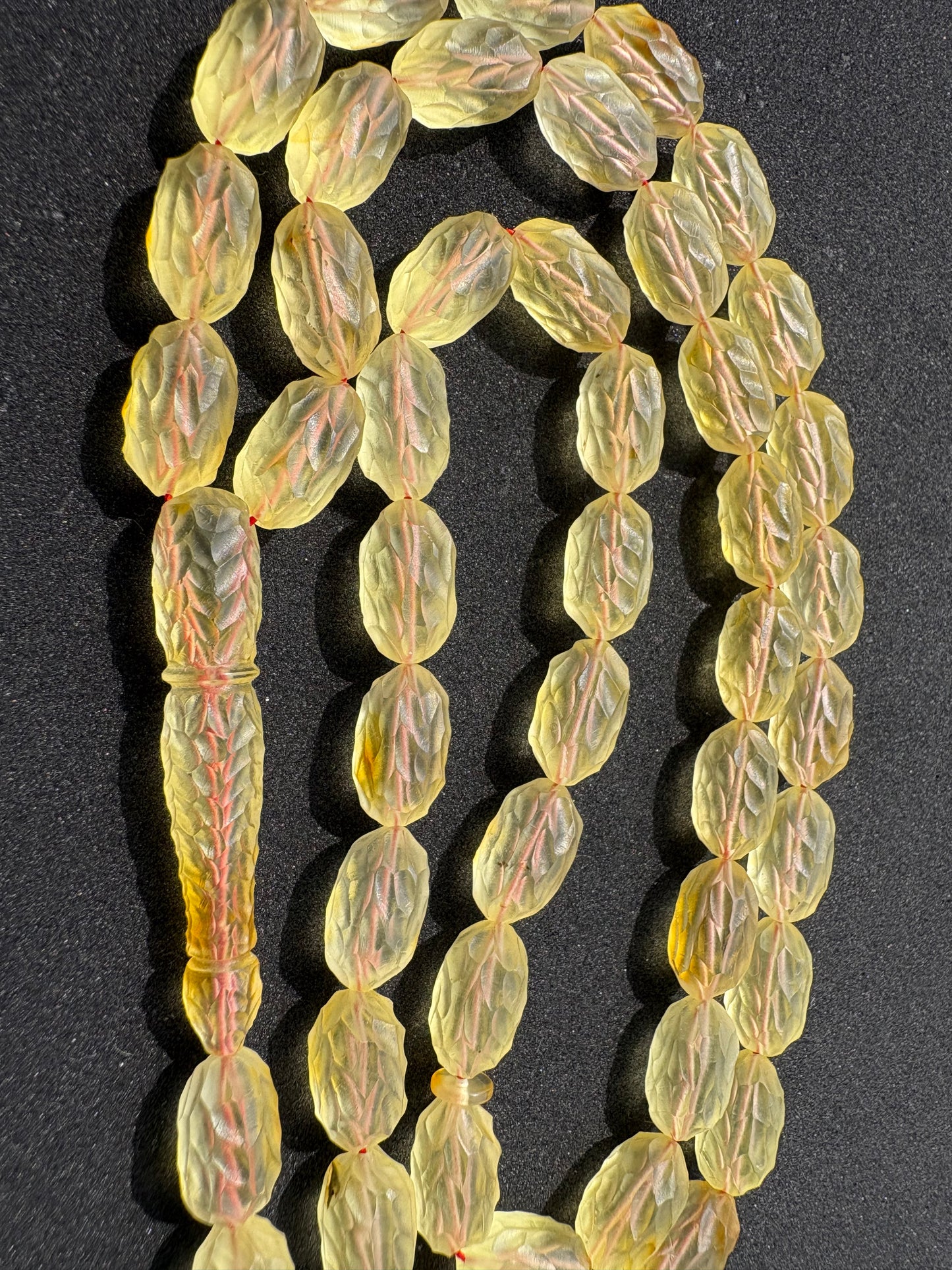Natural Baltic amber Tesbih with 48 hand-carved olive-shaped lemon amber beads.