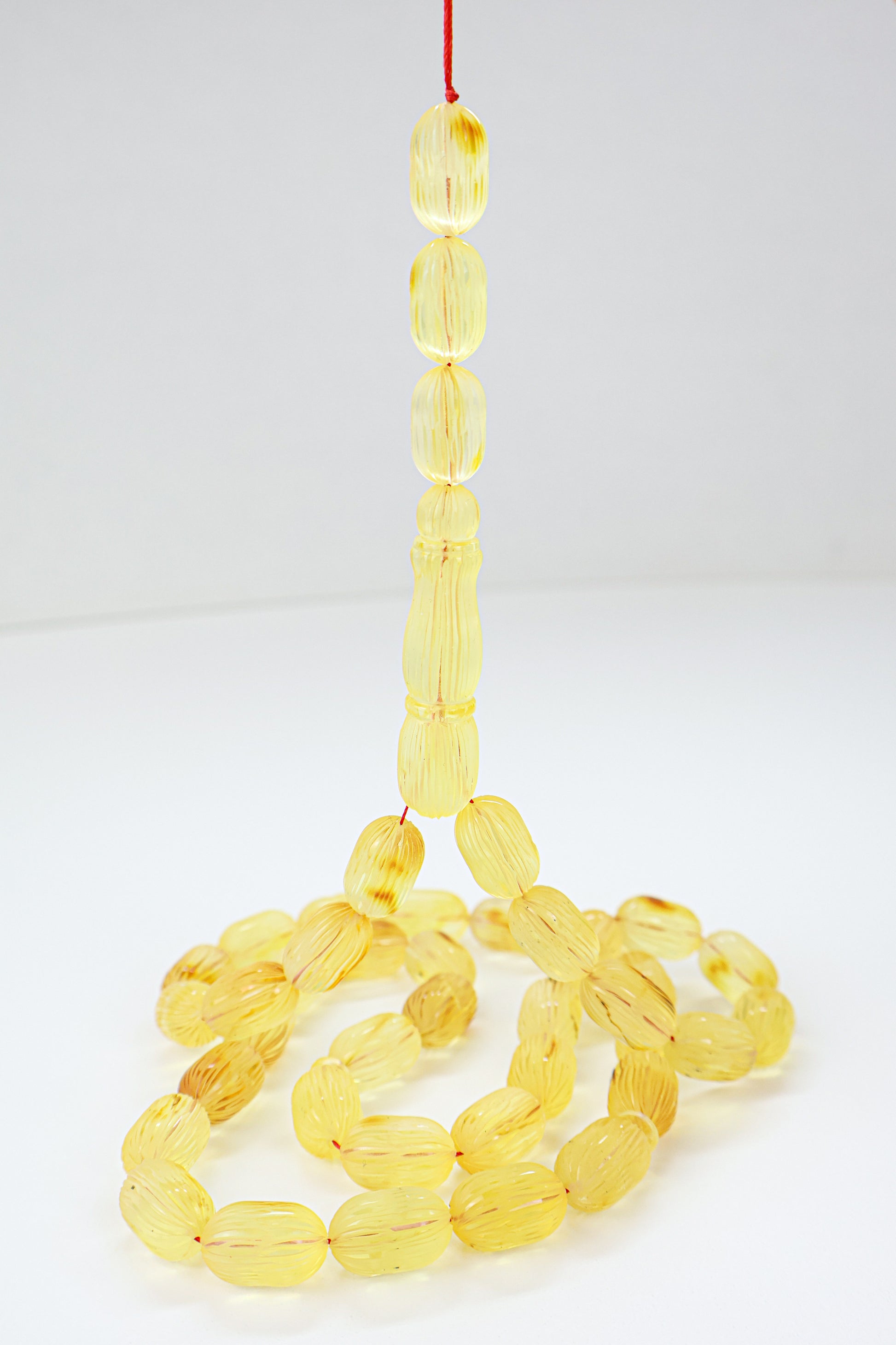 46.71g natural Baltic amber prayer beads (misbaha) with hand-carved ridges certified by Amber Experts Laboratory in Gdansk, Poland.
