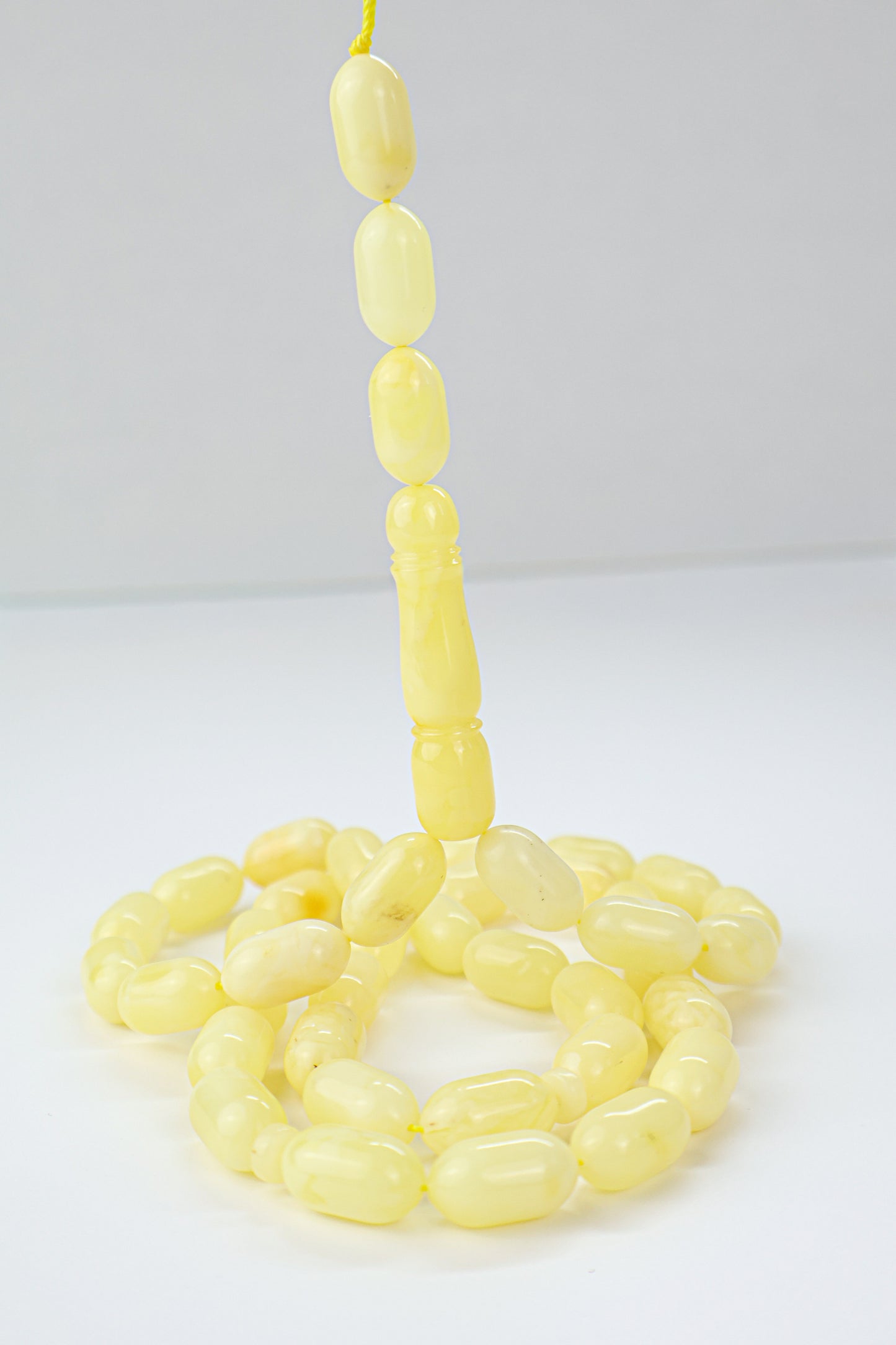 Laboratory certified opaque yellow Baltic amber prayer beads from Tetibel Amber Jewels.