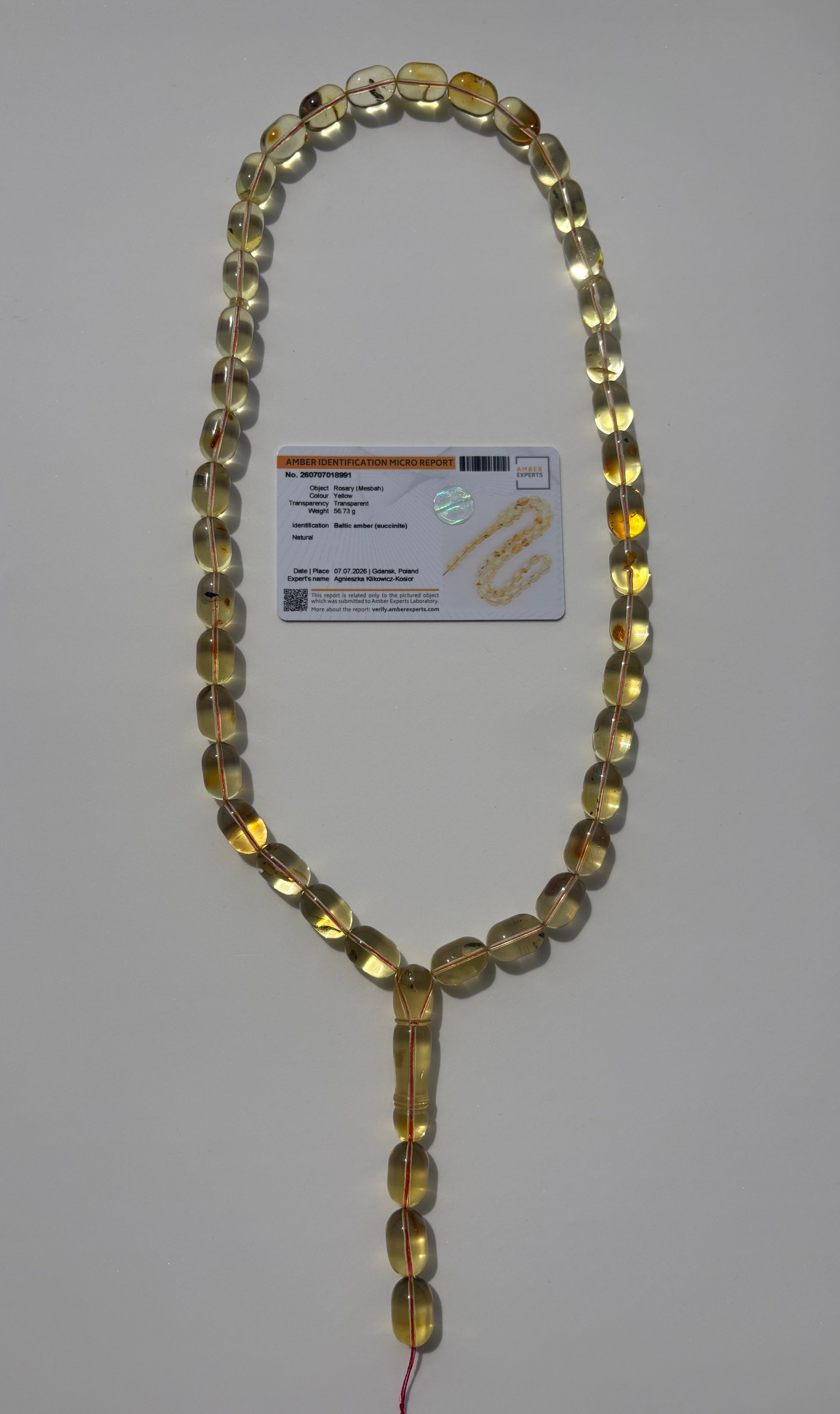 Collector-grade transparent Baltic amber prayer beads with certificate.