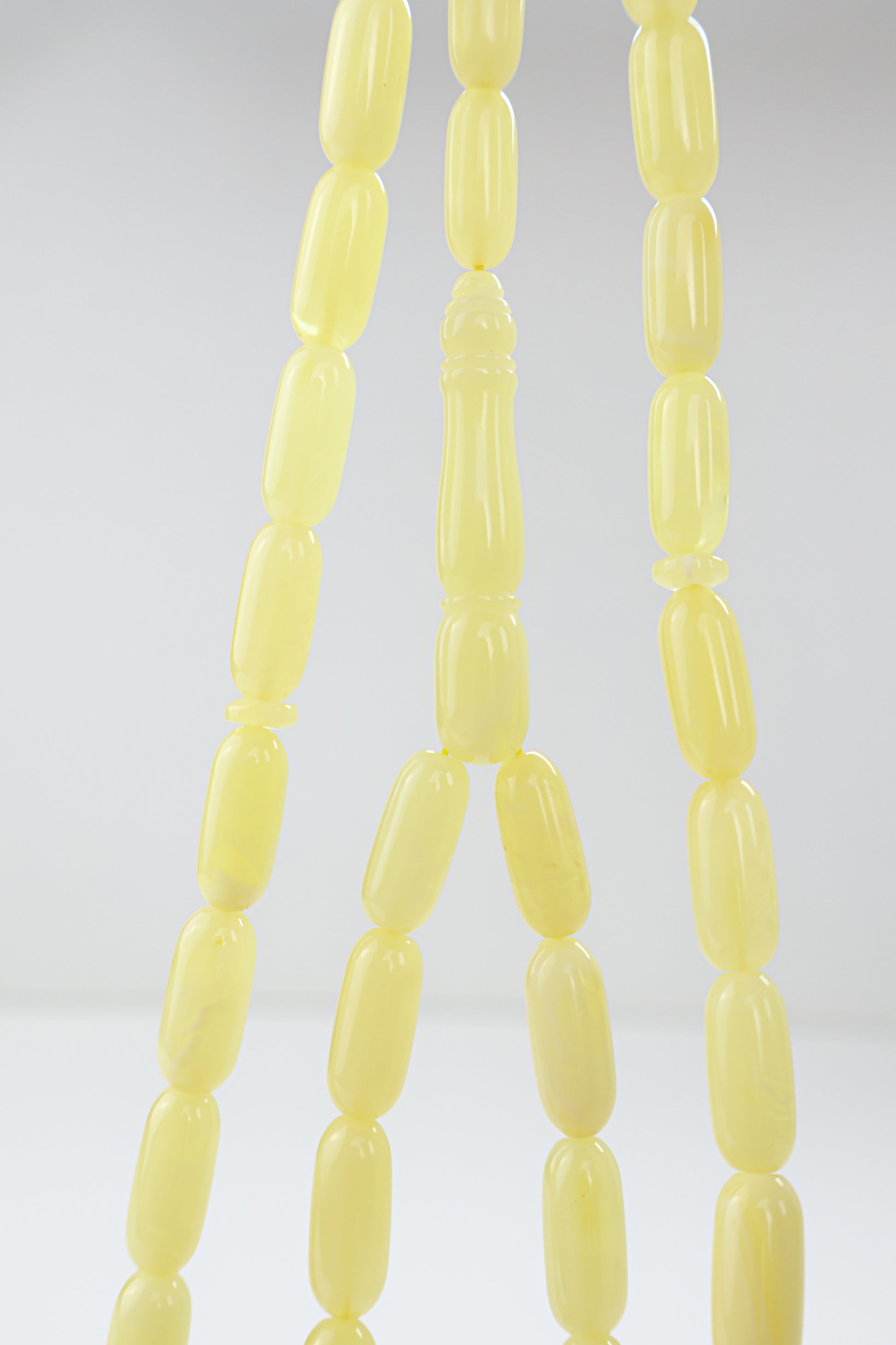 Genuine Baltic amber Mesbah featuring natural opaque creamy yellow amber beads.