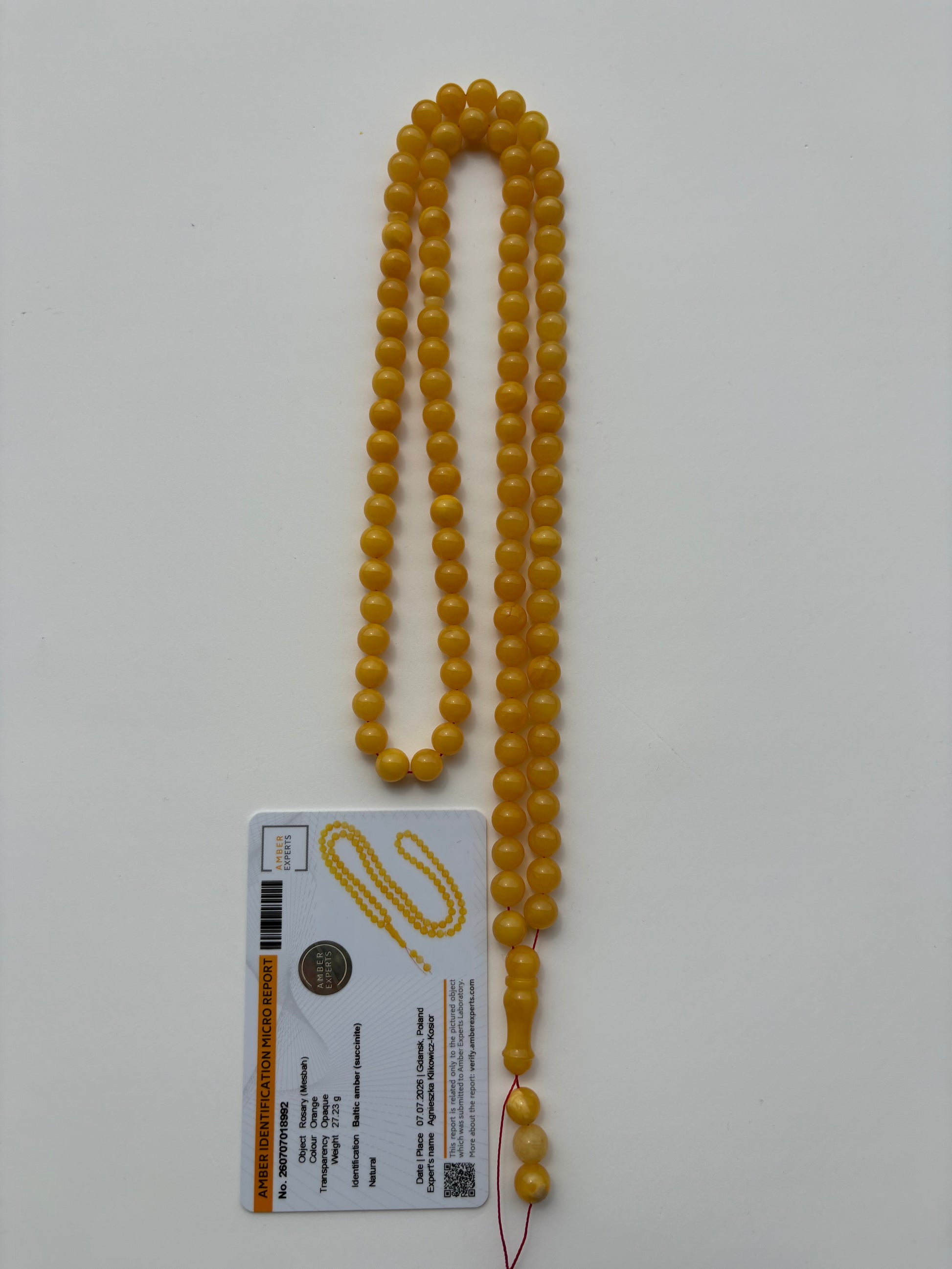Certified natural Baltic amber Misbaha in intense mango yellow color.