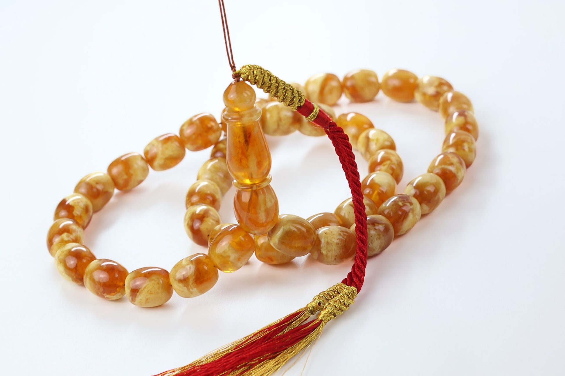 pressed Baltic amber rosary in honey marbled succinite, luxury Tetibel prayer beads made in Europe