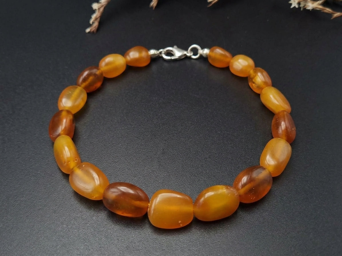Natural honey Baltic amber bead bracelet with a 925 sterling silver lobster clasp by Tetibel Amber Jewels.