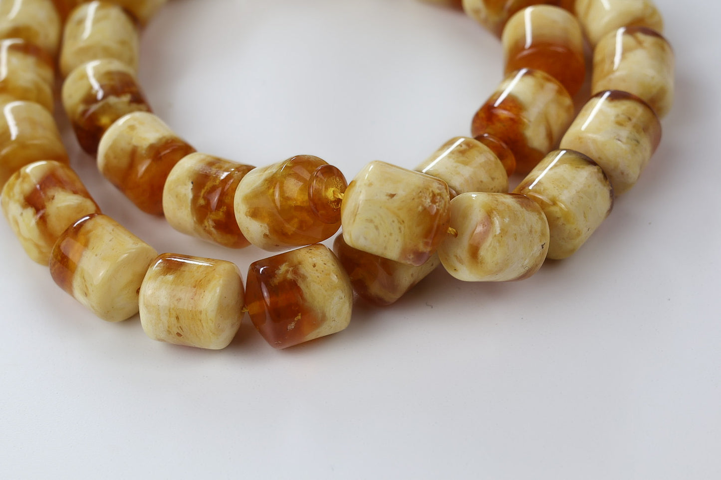 Handcrafted pressed amber Tesbih with cube beads arranged in circular shape, honey and cognac color.