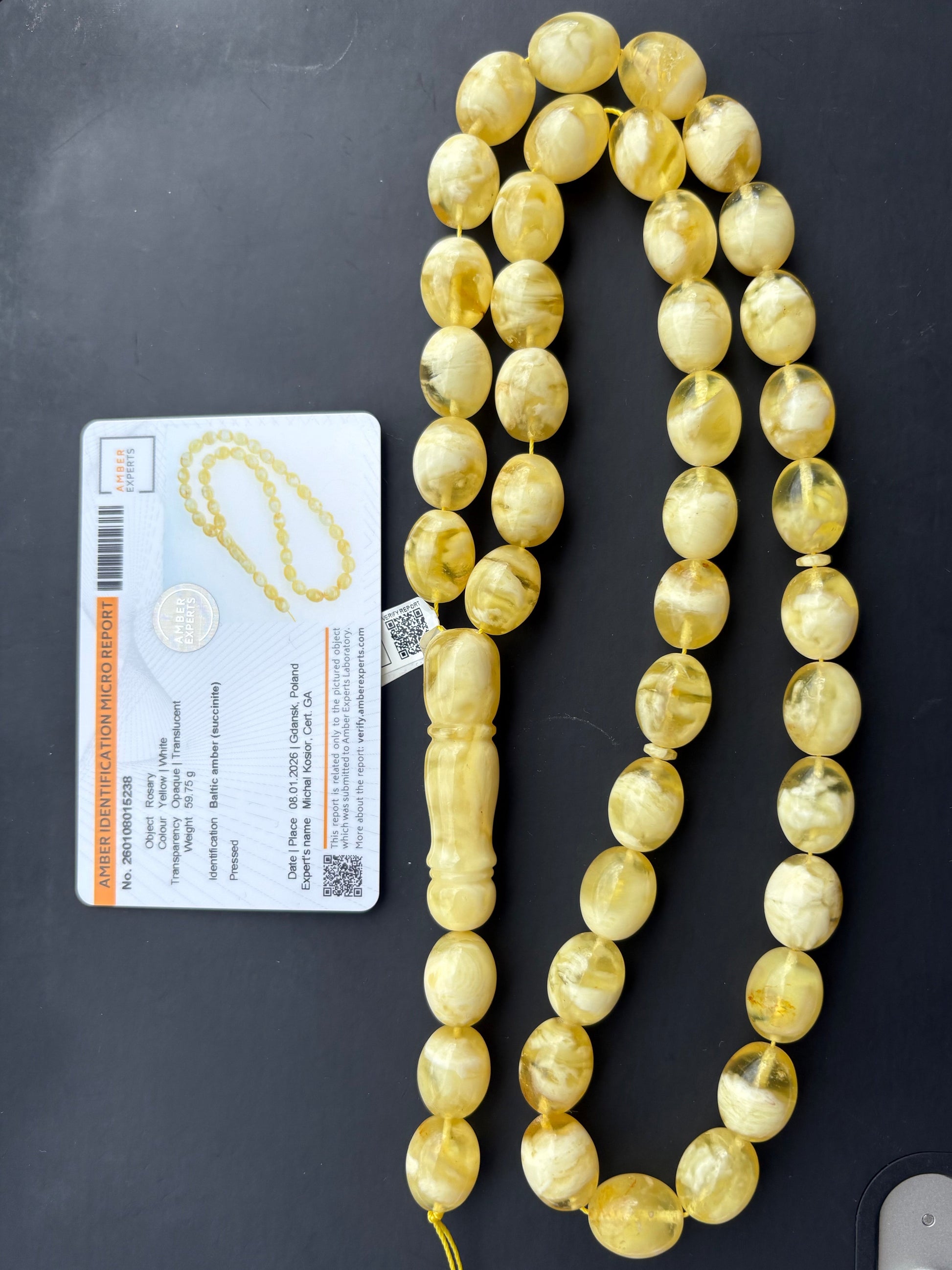 Tetibel Baltic Amber Mesbah rosary featuring 42 certified pressed yellow and white oval beads, measuring 15x12mm and weighing 59.75g, with an Amber Experts certificate from Gdańsk.