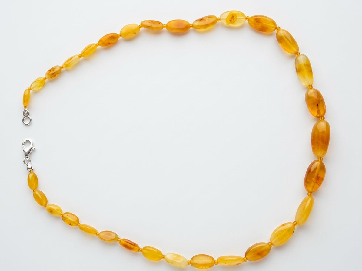 Polished oval amber gemstone necklace with sterling silver clasp from tetibel