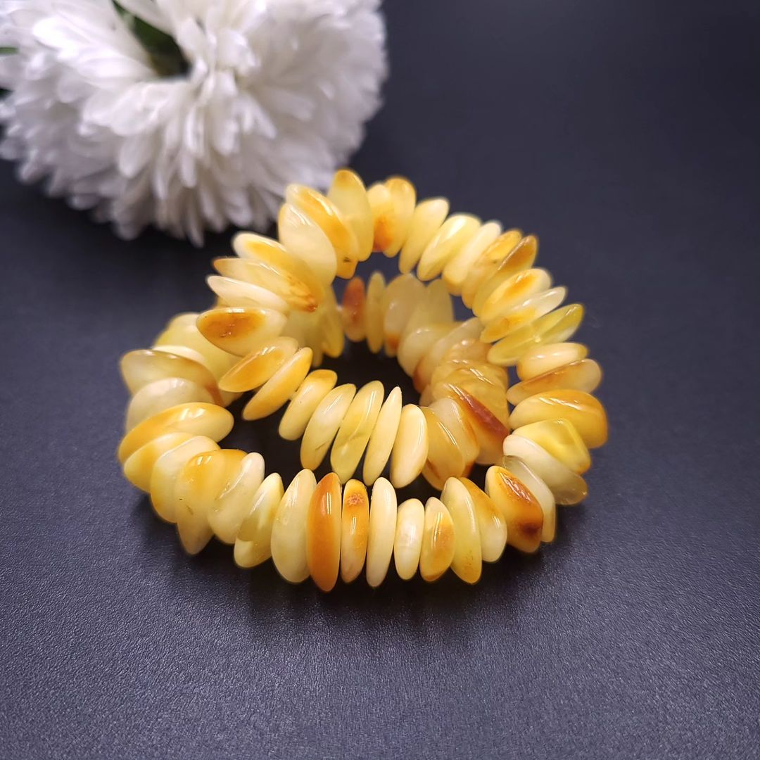 Tetibel yellow amber bracelet featuring raw, unpolished Baltic amber chips on a wrist