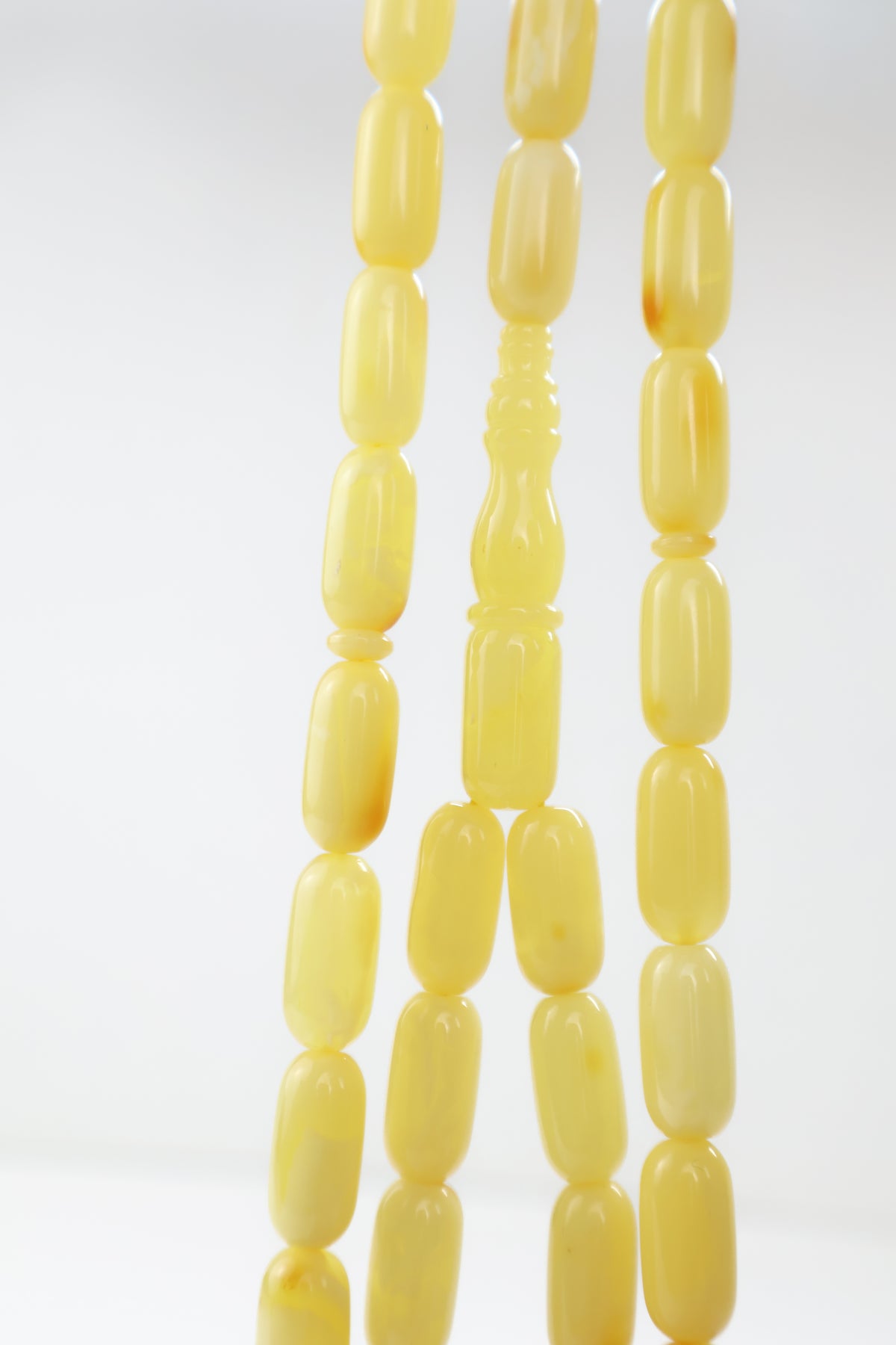Handcrafted yellow-orange succinite amber tasbih weighing 33.42 grams with certified lab report.