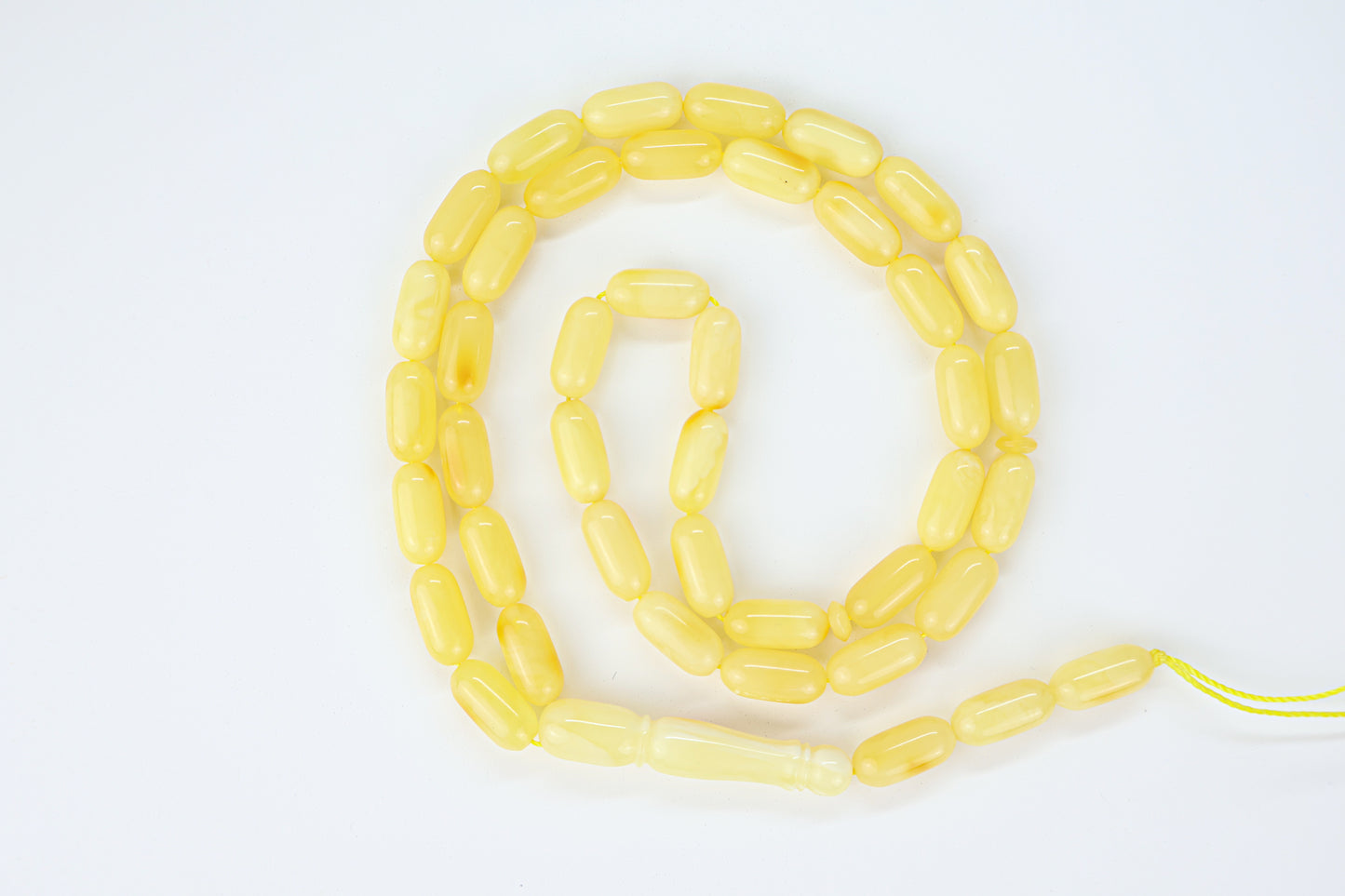 Natural Baltic amber prayer beads with honey orange undertones and laboratory certification.